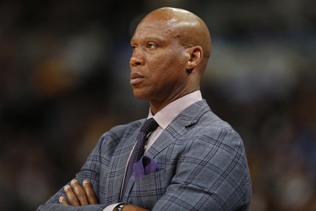Former Lakers coach Byron Scott watches a game against the Nuggets in Denver on March 2.