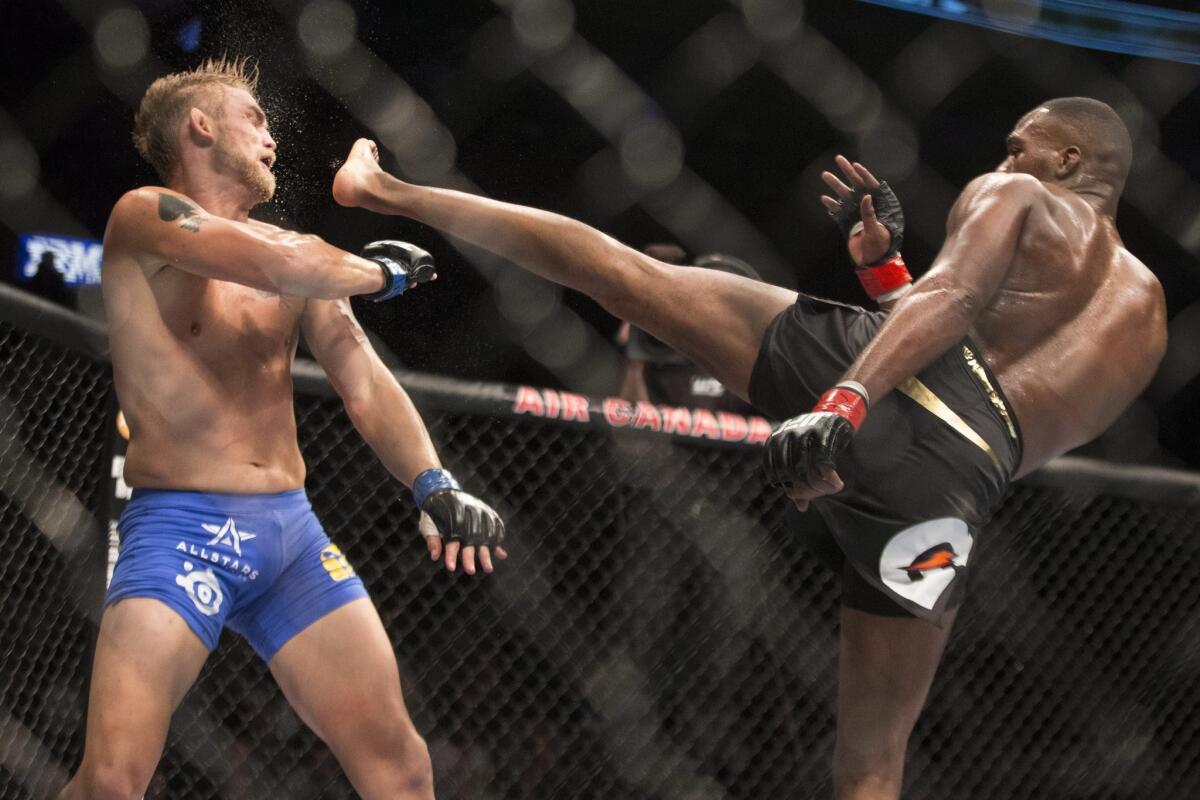 Jone Jones, right, lands a kick to the head of Alexander Gustafsson during their light-heavyweight fight at UFC 165 in Toronto on Saturday.