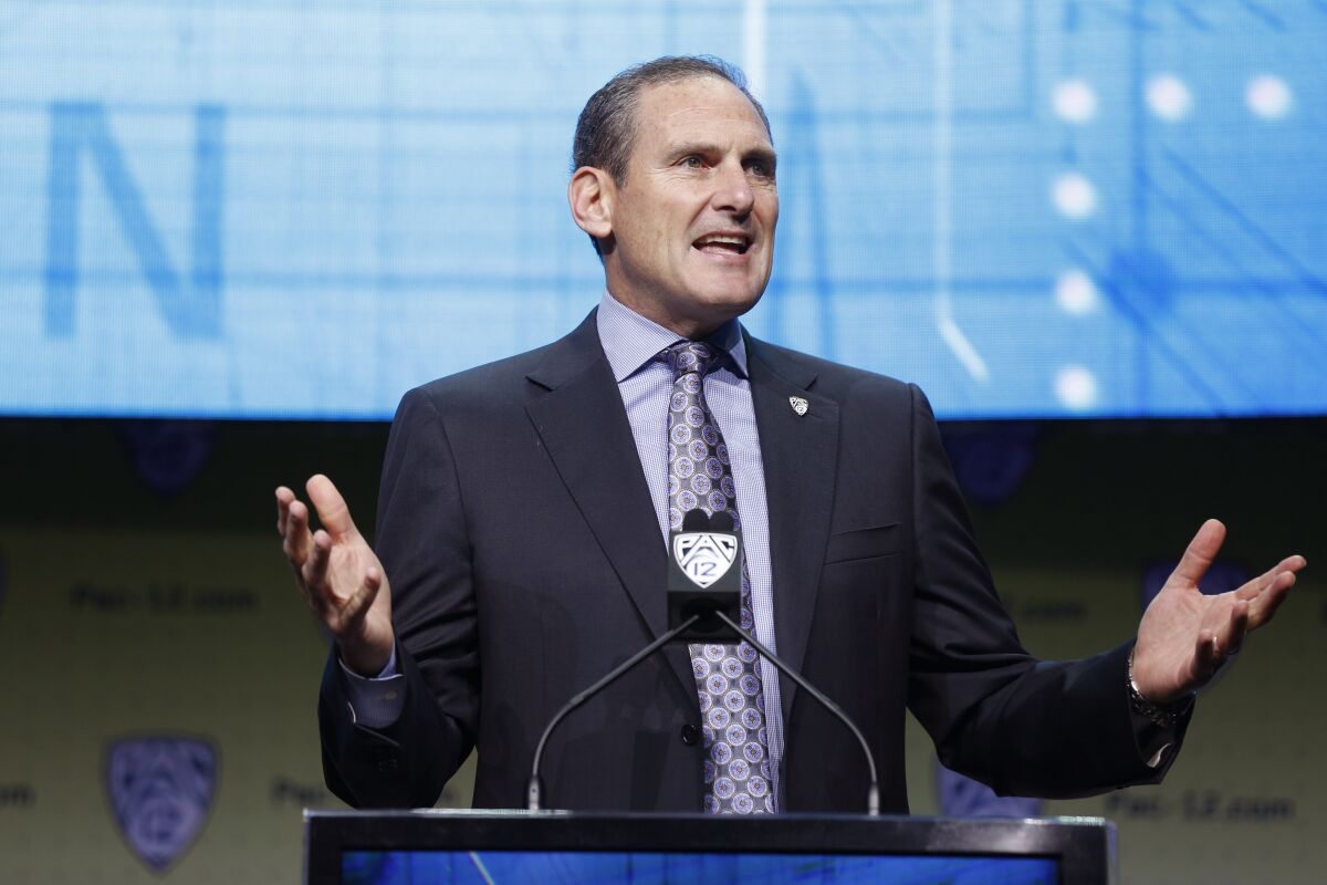 Pac-12 Commissioner Larry Scott speaks at a conference.