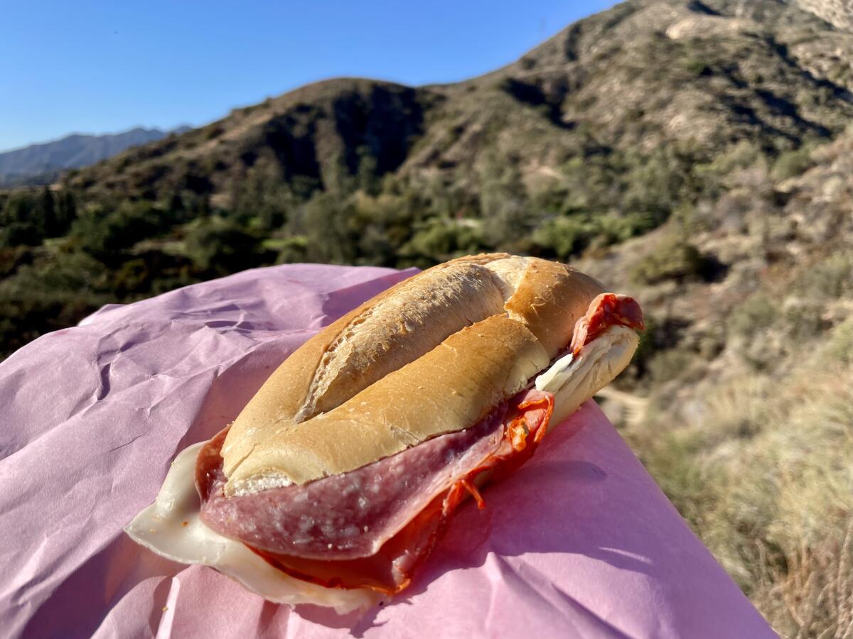The pink-paper-wrapped sandwich from Roma Market is simple, unadorned, inexpensive and ideal for a hike to Echo Mountain.