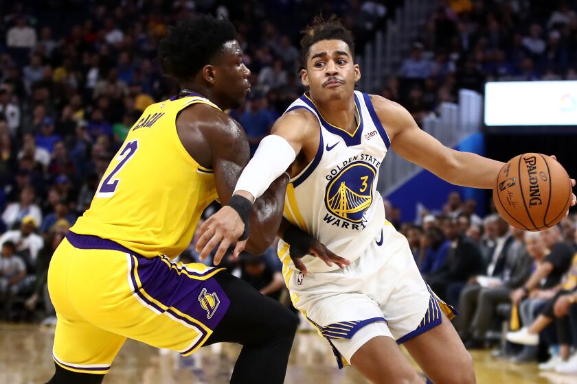 SAN FRANCISCO, CALIFORNIA - OCTOBER 18: Jordan Poole #3 of the Golden State Warriors drives on Devontae Cacok #12 of the Los Angeles Lakers at Chase Center on October 18, 2019 in San Francisco, California. NOTE TO USER: User expressly acknowledges and agrees that, by downloading and or using this photograph, User is consenting to the terms and conditions of the Getty Images License Agreement. (Photo by Ezra Shaw/Getty Images)