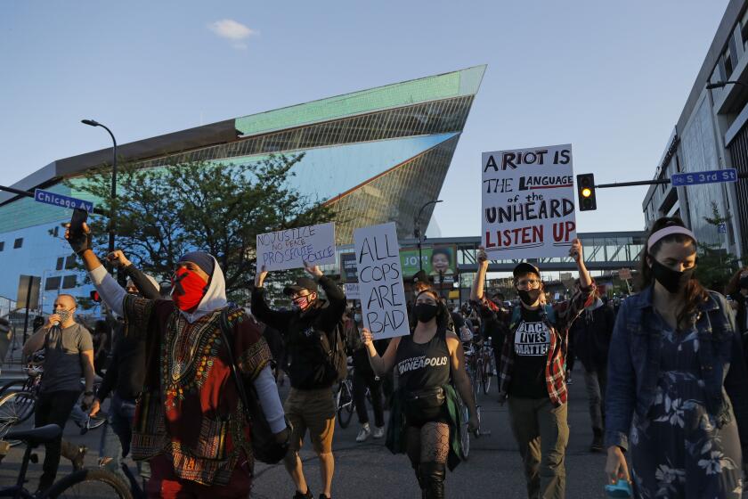 Protesters gather outside the Minnesota Vikings football stadium Friday, May 29, 2020, in Minneapolis. Protests continued following the death of George Floyd, who died after being restrained by Minneapolis police officers on Memorial Day. (AP Photo/Julio Cortez)