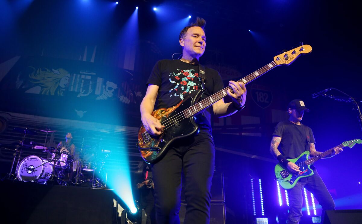 Drummer Travis Barker, singer/bassist Mark Hoppus and guitarist Matt Skiba of Blink-182 perform 