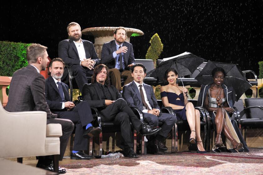 Host Chris Hardwick (bottom row from left), actors Andrew Lincoln, Norman Reedus, Steven Yeun, Lauren Cohan, Danai Gurira and (top row from left) creator Robert Kirkman and showrunner Scott Gimple at the Hollywood Forever Cemetery on Sunday for "Talking Dead Live."