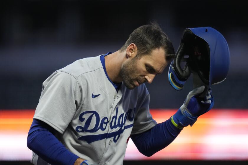 Los Angeles Dodgers' Chris Taylor reacts after striking out against the San Francisco Giants during the fourth inning of a baseball game in San Francisco, Tuesday, April 11, 2023. (AP Photo/Godofredo A. Vásquez)