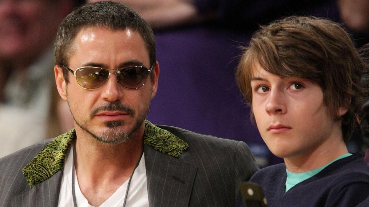 Robert Downey Jr. and eldest son Indio Downey at a Los Angeles Lakers game back in 2008, when the younger Downey was 14. Indio, who turns 21 next month, has been charged with felony drug possession and misdemeanor possession of drug paraphernalia.