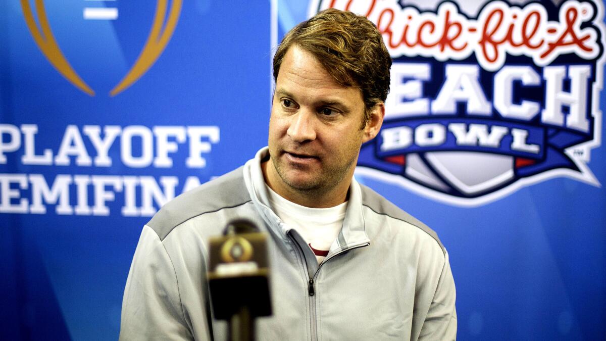 Former Alabama offensive coordinator Lane Kiffin talks to reporters during media day at the Peach Bowl.