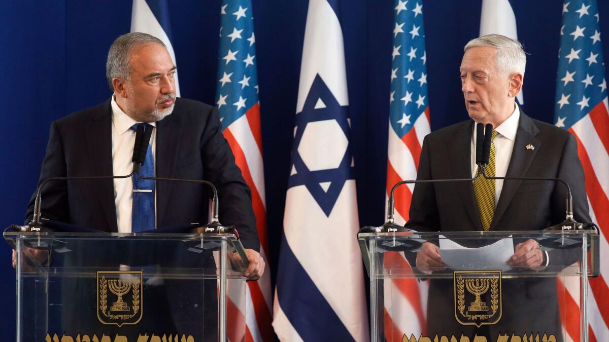 Defense Secretary James Mattis, right, and Israeli Defense Minister Avigdor Lieberman hold a joint news conference in Tel Aviv on April 21.
