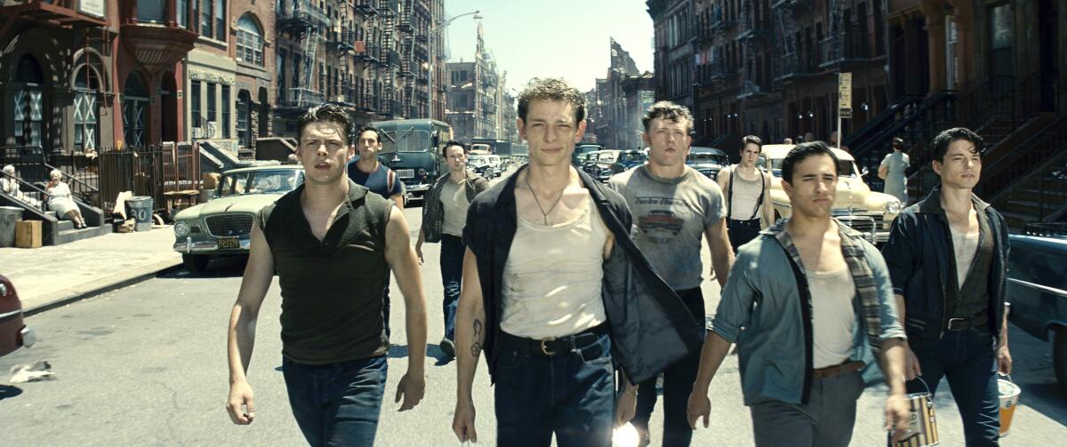 Mike Faist as Riff walks at the lead of his fellow Jet gang members in 'West Side Story.'