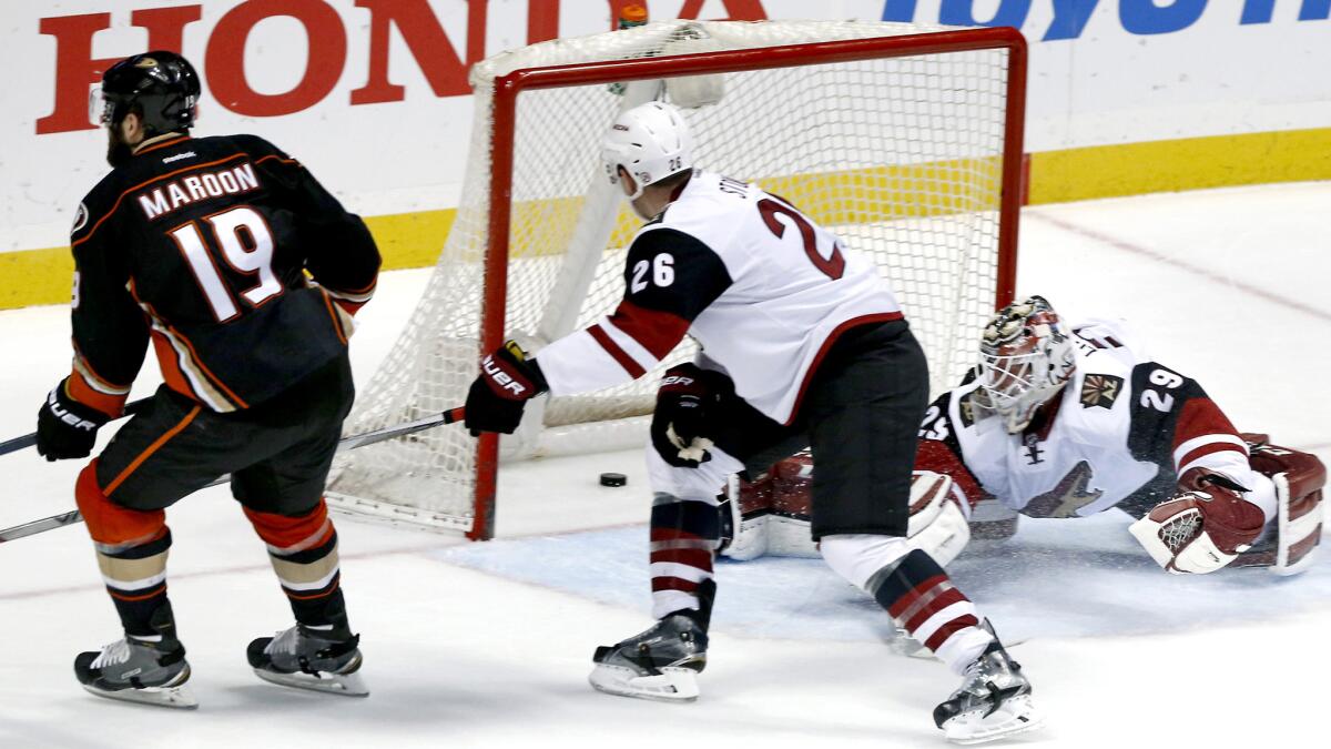 Coyotes goalie Anders Lindback can't stop a shot by Ducks left wing Patrick Maroon, left, in the third period Friday.