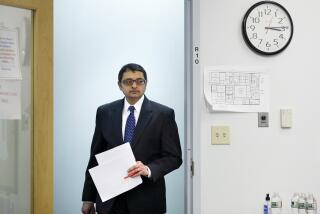 Dr. Nirav Shah, director of the Maine Center for Disease Control and Prevention, arrives at a news conference, Tuesday, April 28, 2020, in Augusta, Maine.(AP Photo/Robert F. Bukaty)