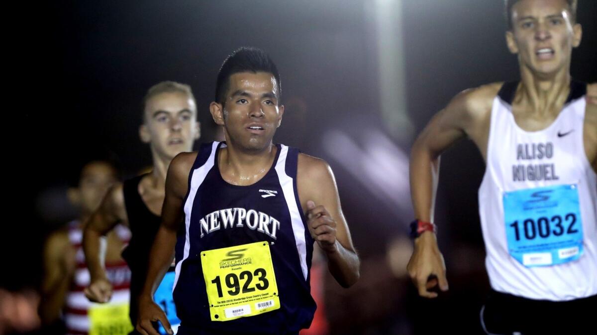 Newport Harbor High's Alexis Garcia, pictured running in the Woodbridge Cross Country Classic on Sept. 14, won the Surf League title at Central Park in Huntington Beach on Friday.