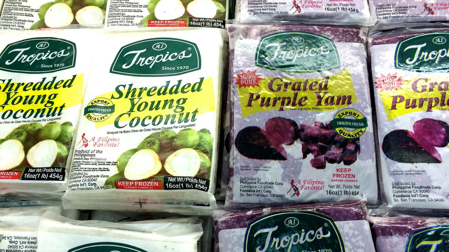 Purple yams and shredded coconut in the freezer case at Seafood City.