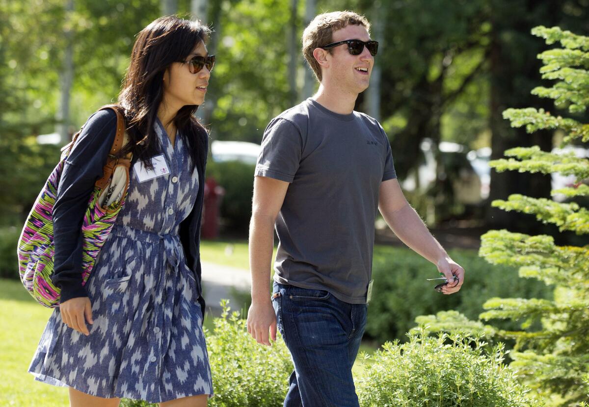 Facebook CEO Mark Zuckerberg and his wife, Dr. Priscilla Chan, in 2011.