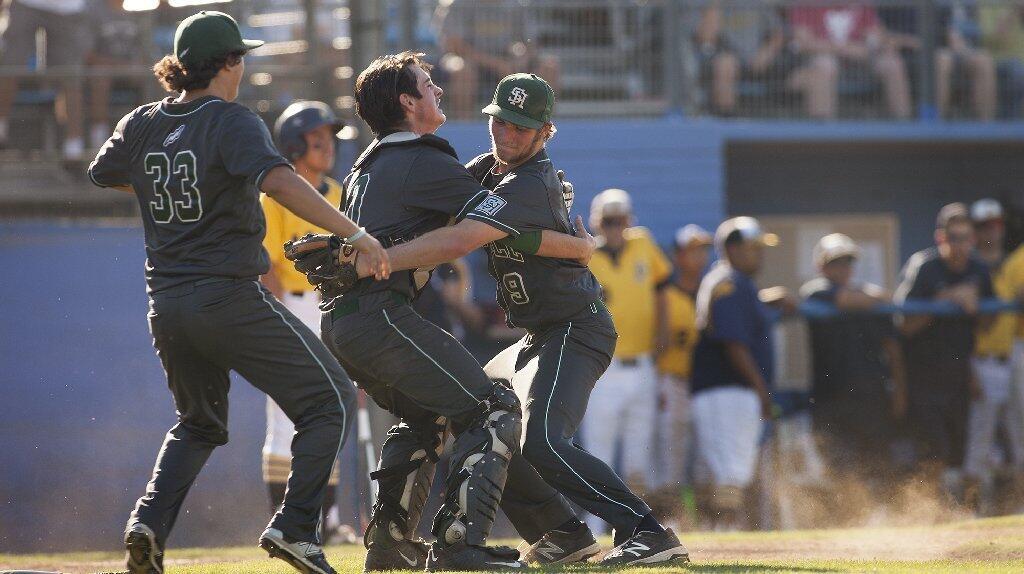 Sage Hill School's Brett Super (9), Toby Bush and Conner Hatz (33) celebrate beating Crean Lutheran, 9-0, in the CIF-SS Division 6 baseball championship game at UCR Sports Complex in Riverside on Saturday.