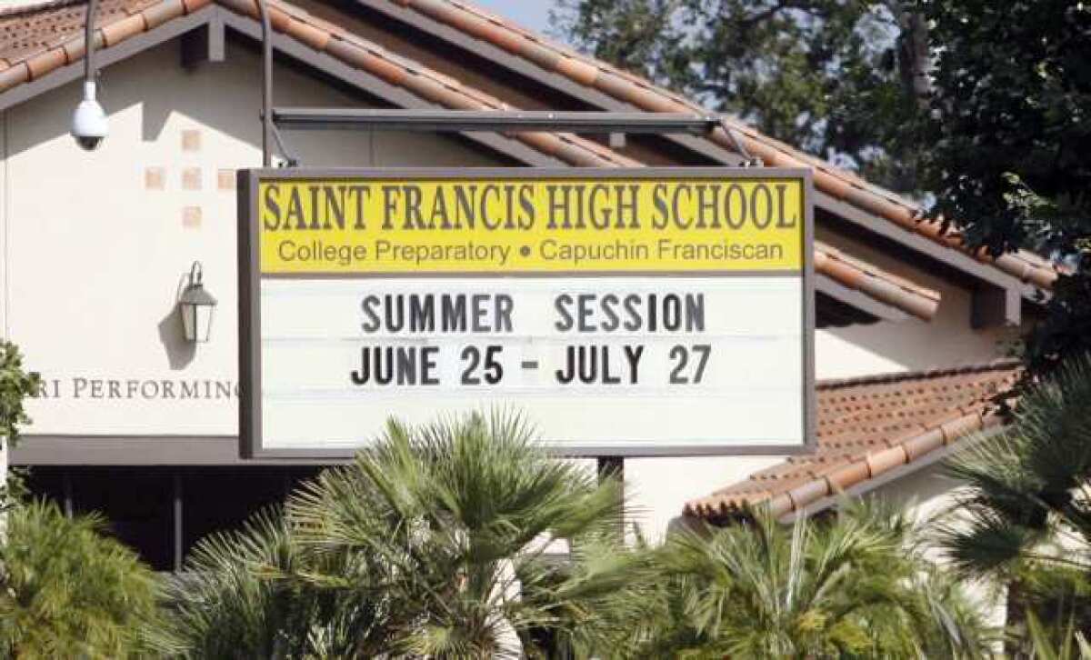 Some Council members worry that replacing St. Francis High School's sign with an electronic reader would ruin the community's aesthetic.