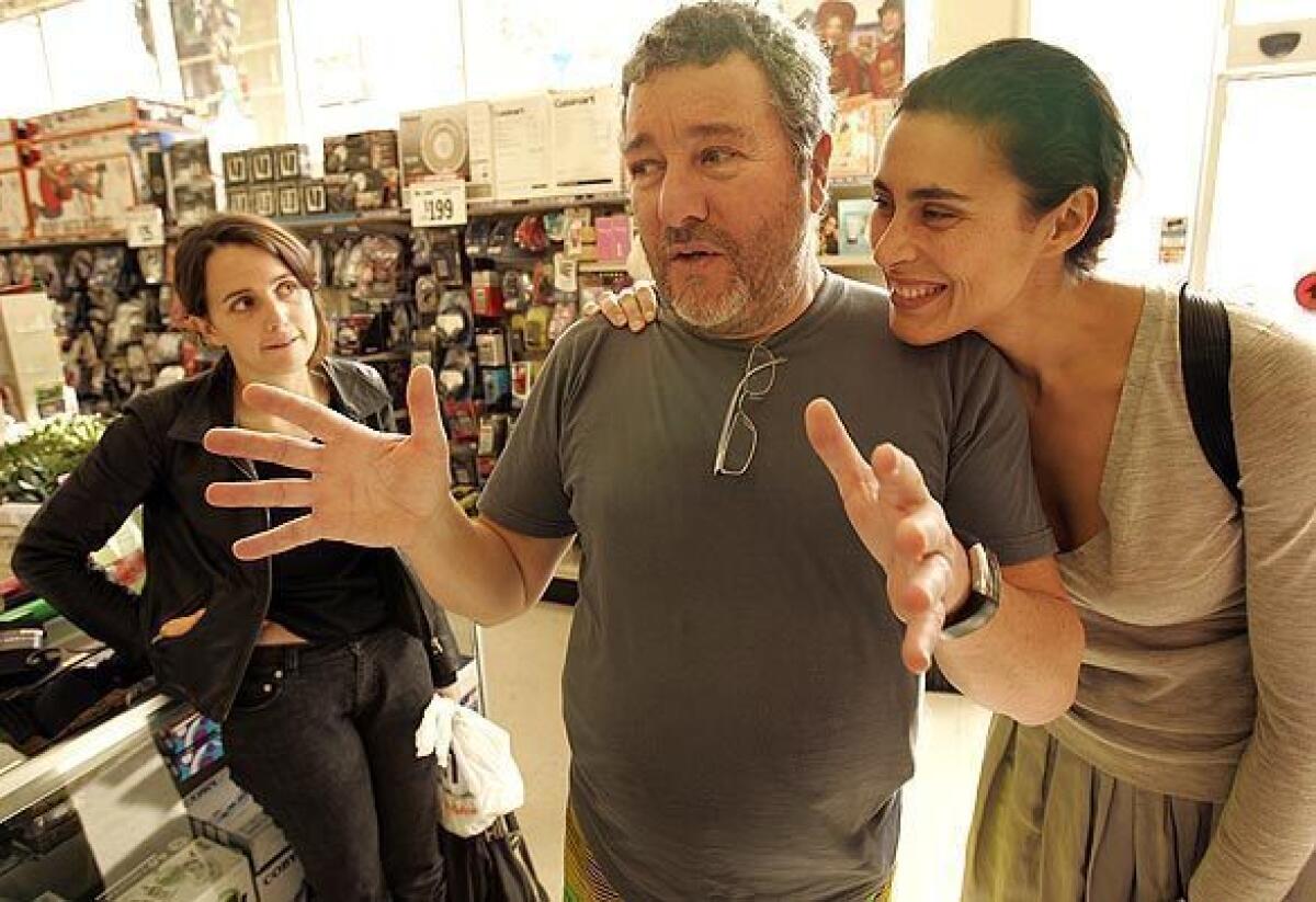 Famed designer Philippe Starck, his wife, Jasmine, right, and daughter Ara go shopping at a Big Lots store in Hollywood in 2008 to show how far a dollar can go in recessionary times.