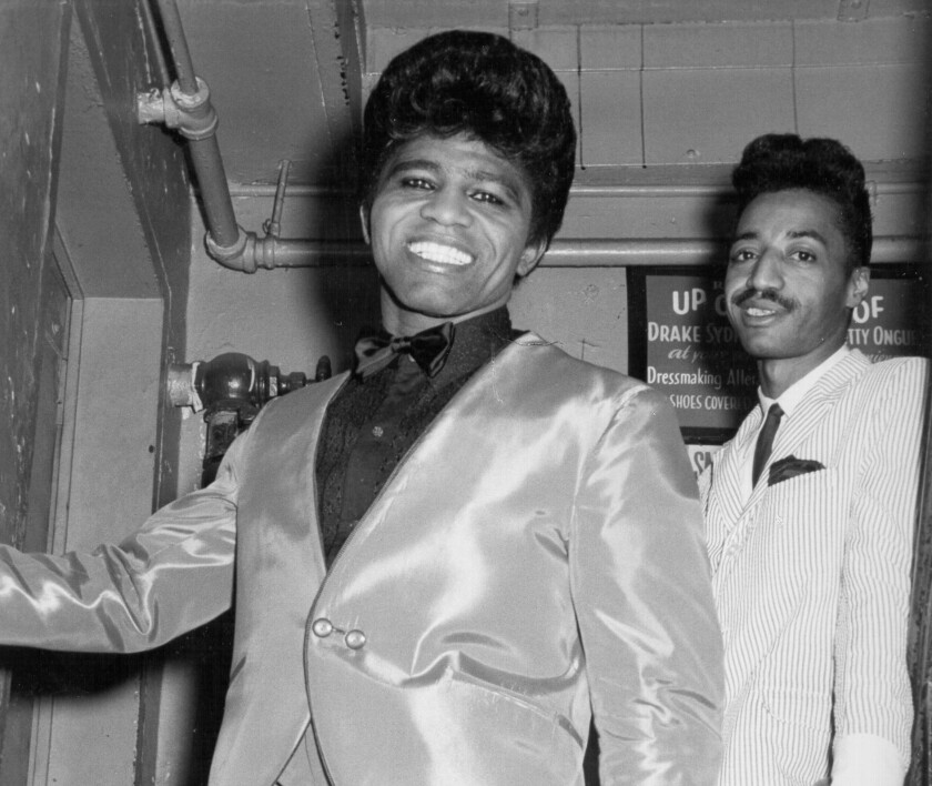 James Brown backstage at Harlem's Apollo Theatre with Danny Ray in 1964.