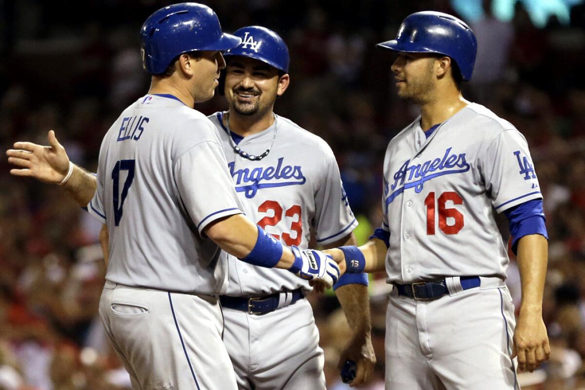 The Dodgers' clubhouse leadership next season is likely to include catcher A.J. Ellis, first baseman Adrian Gonzalez (23) and outfielder Andre Ethier (16), who are celebrating a three-run homer by Ellis during a game last season.