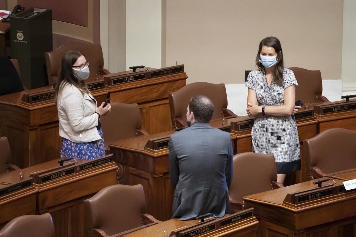 Minnesota lawmakers Jamie Becker-Finn, Jamie Long, Liz Olson