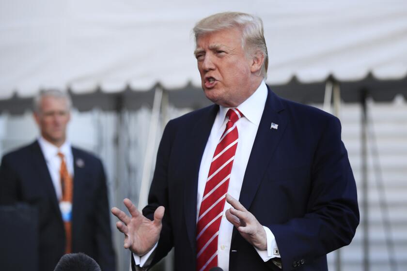 In this Oct. 7, 2017, photo, President Donald Trump speaks to reporters before leaving the White House in Washington for a brief stop at Andrews Air Force Base in Md., on his way to Greensboro, N.C.