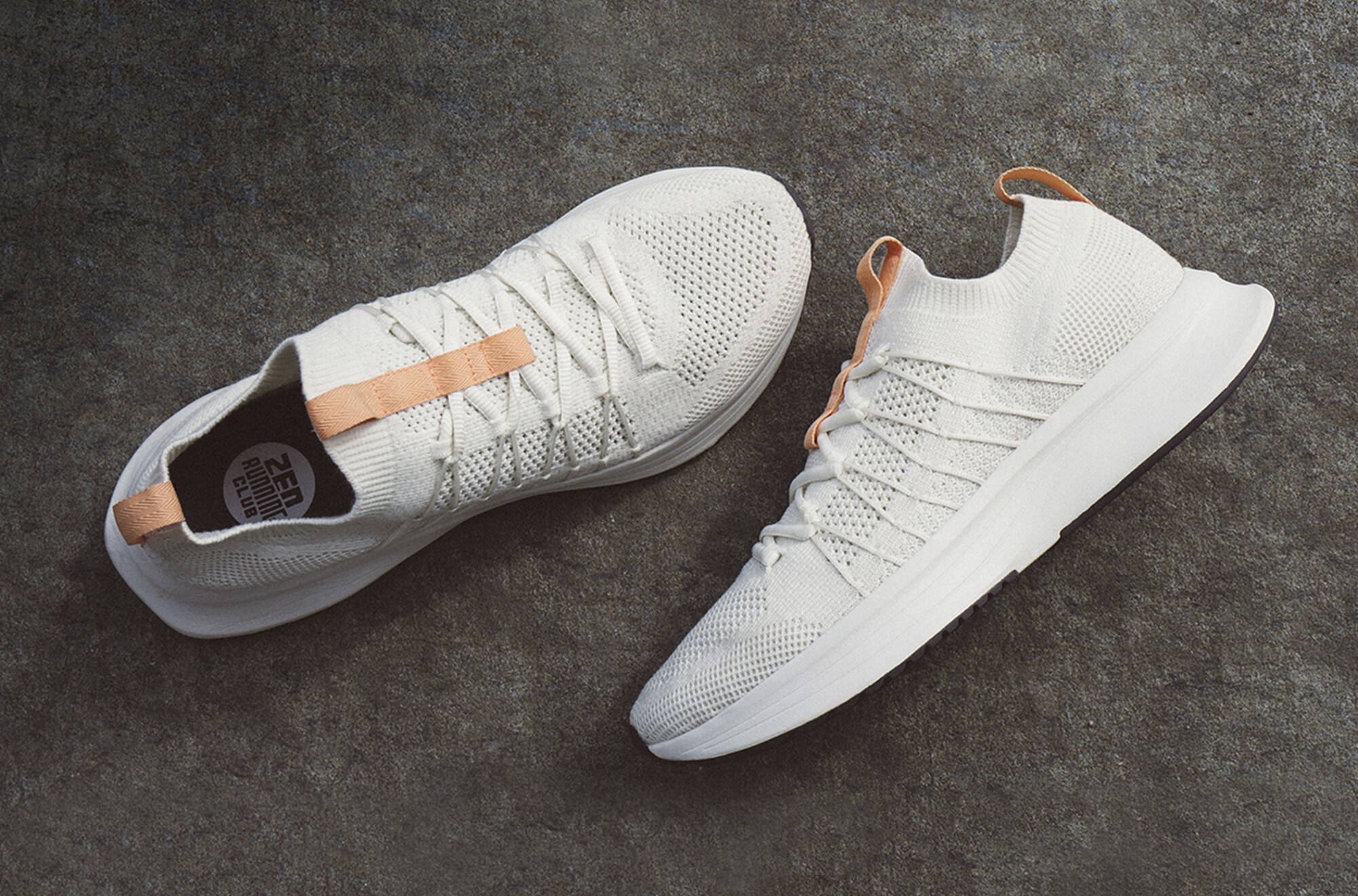 A pair of white running shoes