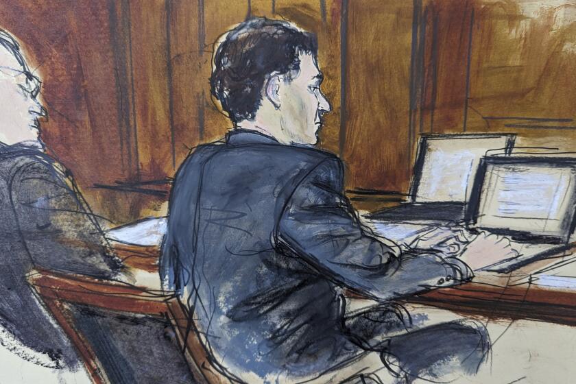 In this courtroom sketch, FTX founder Sam Bankman-Fried, right, sits at the defense table next to his attorney Christian Everdell as jury selection began in his fraud trial, Tuesday, Oct. 3, 2023. (AP Photo/Elizabeth Williams)