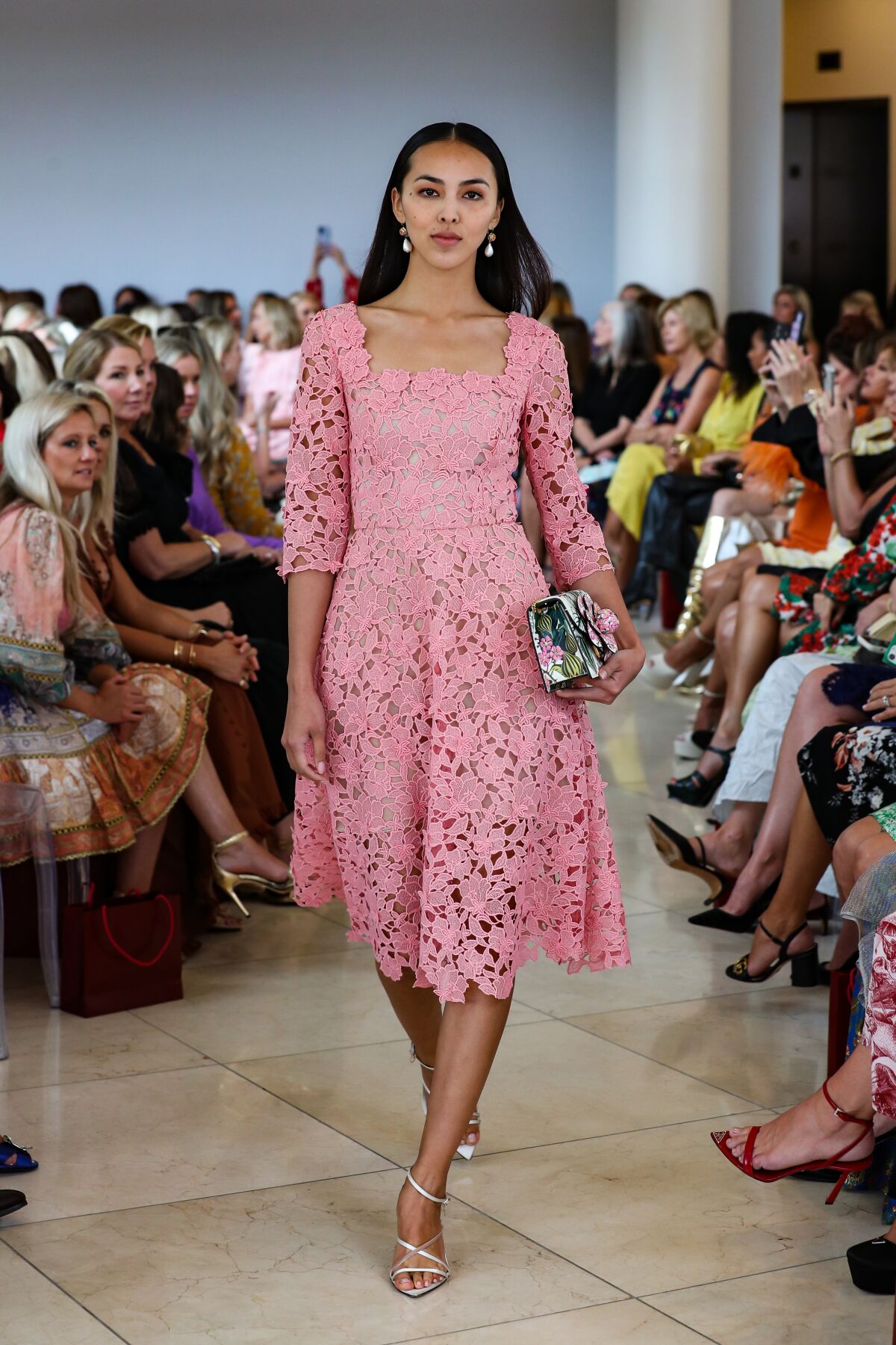 A model walks to display Oscar de la Renta fashion at the Harvesters Fashion Show on Oct. 11.