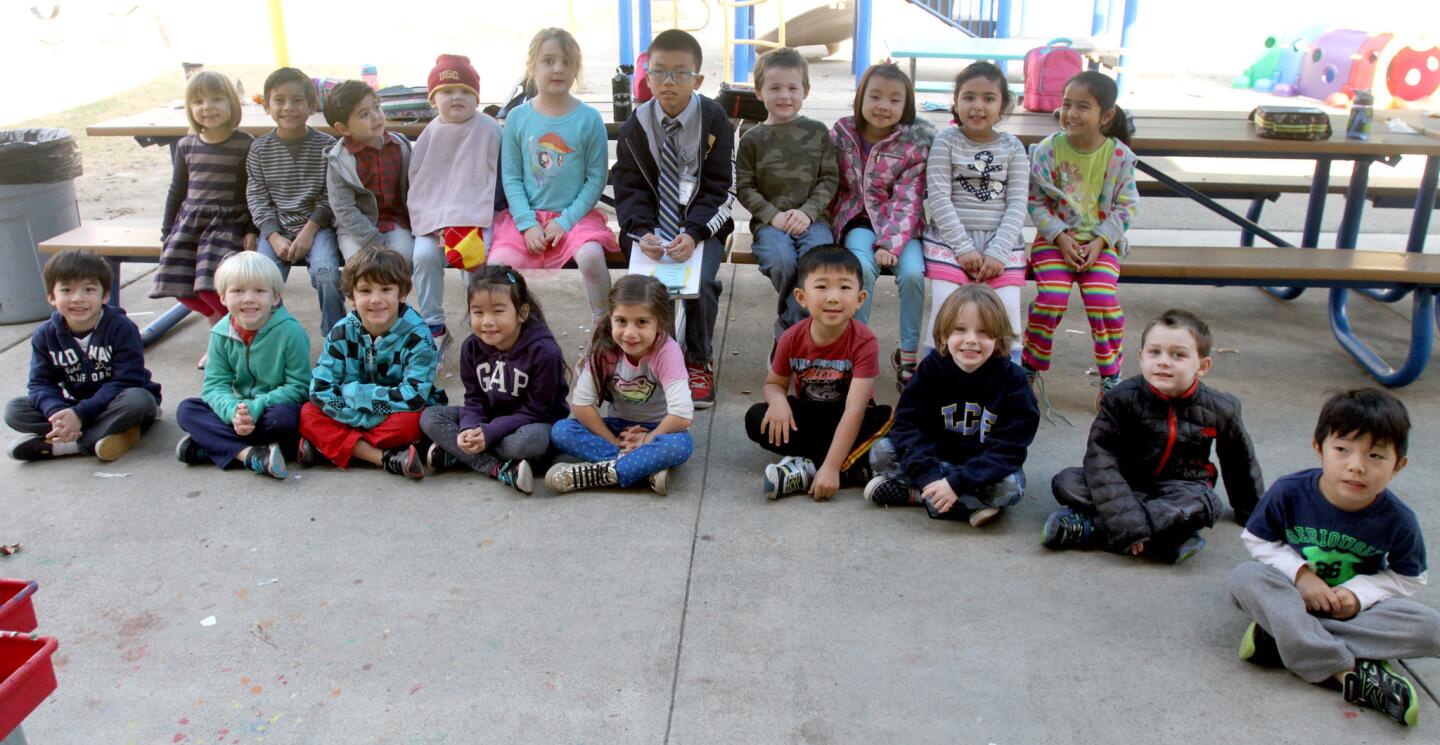 La Cañada Elementary School "Principal for a Day" and fifth-grader Michael Kwan, sitting at center, poses with the transitional Kindergarten class, during recess.