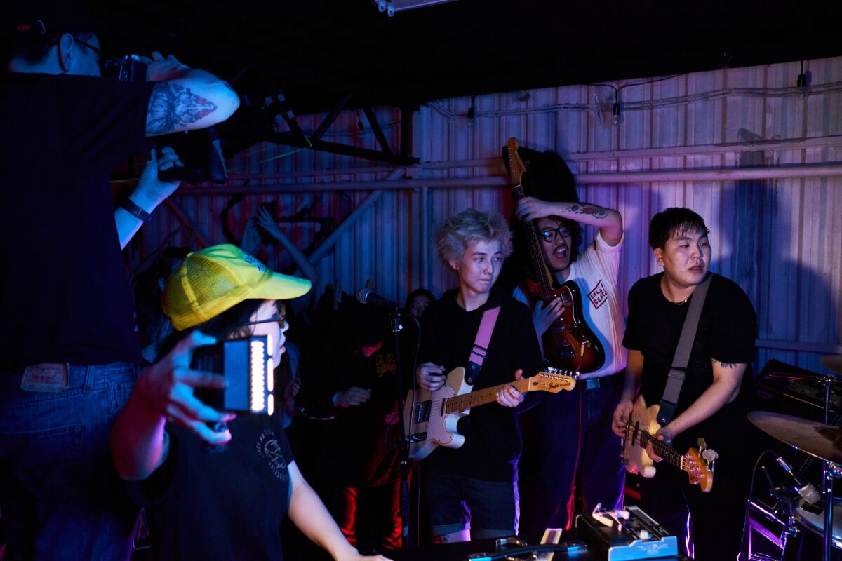 Vlad Sleptsov, center, performs with the Name of Your Ex-Girlfriend during a punk rock concert in Yakutsk, Russia.