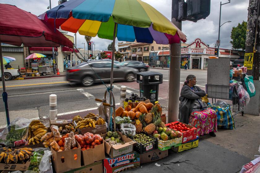 LOS ANGELES, CA - MARCH 16: Street vendors along Cesar Chavez Ave in the neighborhood of Boyle Heights on Thursday, March 16, 2023 in Los Angeles, CA. (Irfan Khan / Los Angeles Times)