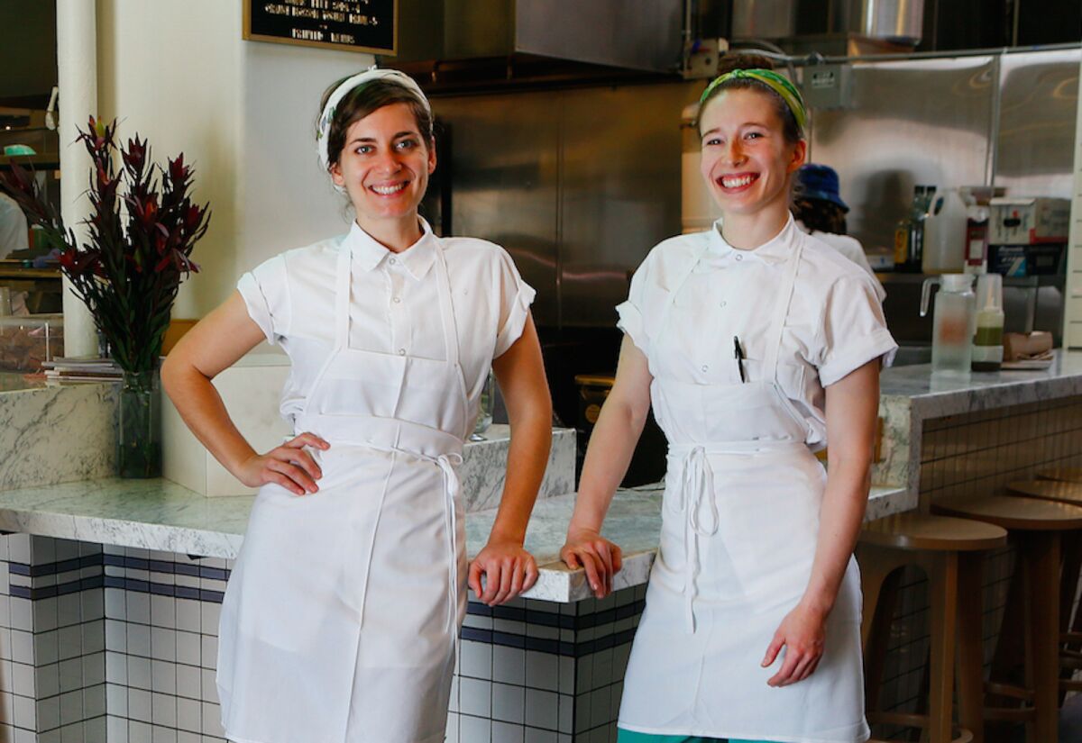 Sara Kramer, left, and Sarah Hymanson in front of their falafel stand Madcapra in Grand Central Market in downtown Los Angeles. The two have teamed up with Jon Shook and Vinny Dotolo of Animal to open a restaurant called Kismet in Los Feliz.