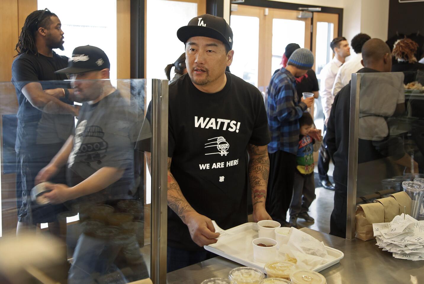 Chef Roy Choi calls out an order number at LocoL, the new fast-food project that he and chef Daniel Patterson have opened in Watts.