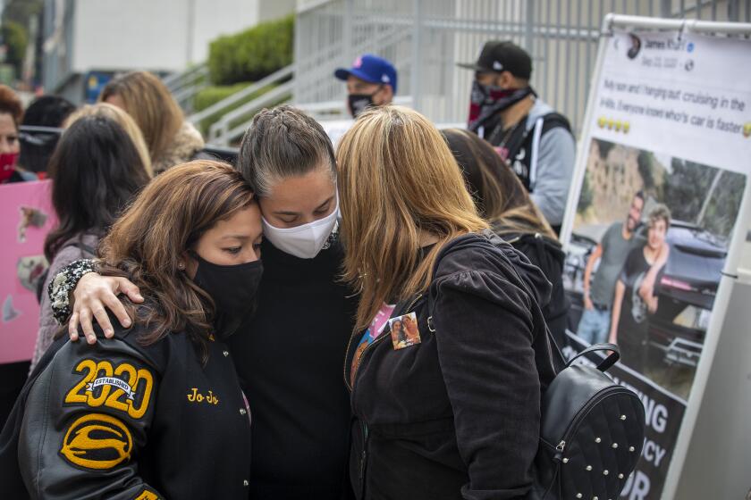Inglewood, CA - April 23: Family, friends and supporters of Monique Munoz embrace and protest outside the Inglewood Juvenile Courthouse where the teen son of a wealthy L.A. entrepreneur was pleading guilty to vehicular manslaughter in the death of Munoz Friday, April 23, 2021. Munoz, 32, of Hawthorne, California, was driving home from work shortly after 5 p.m. on Feb. 17 in West Los Angeles when a black Lamborghini SUV traveling at a high rate of speed collided with her Lexus sedan, police said. (Allen J. Schaben / Los Angeles Times)