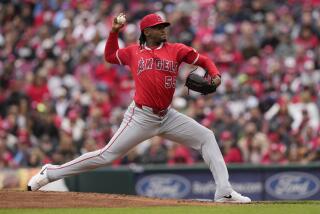 Los Angeles Angels starting pitcher José Soriano throws in the first inning of a baseball game.