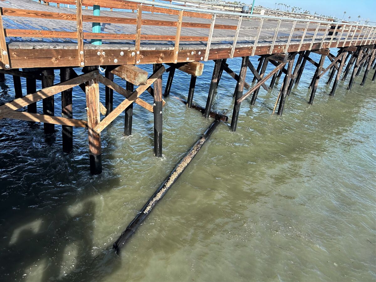 A pylon on the Seal Beach Pier, seen Friday, was one of several washed away by Thursday night's high surf.