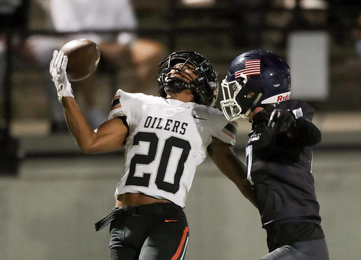 Huntington Beach receiver Hideo Ray completes a juggling, one-handed catch for a touchdown.