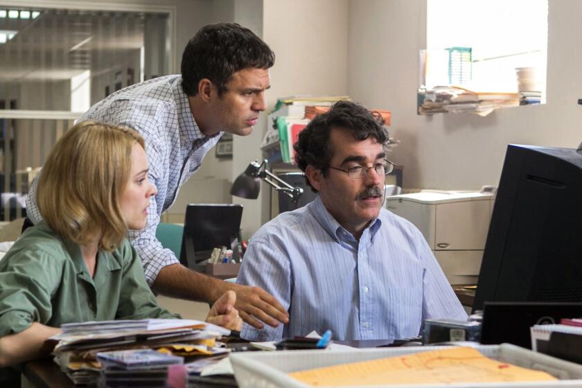 FILE - This photo provided by courtesy of Open Road Films shows, Rachel McAdams, from left, as Sacha Pfeiffer, Mark Ruffalo as Michael Rezendes and Brian dArcy James as Matt Carroll, in a scene from the film, "Spotlight." Oscar contenders "Spotlight" and "The Big Short" won the top awards for screenwriting from the Writers Guild of America at a ceremony Saturday, Feb. 13, 2016, that was held in Los Angeles and New York. (Kerry Hayes/Open Road Films via AP, File) ORG XMIT: NY110