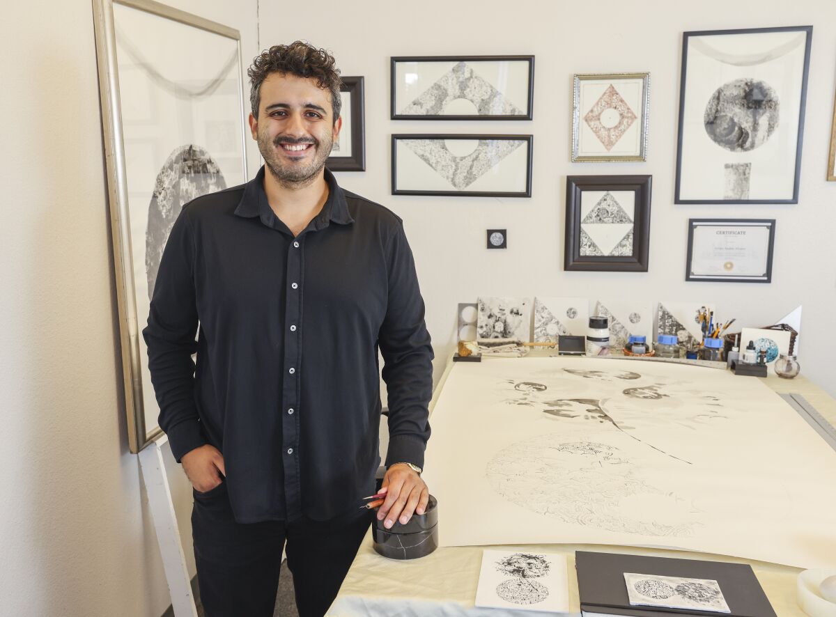 Artist Alvaro Alvarez poses in his work studio in San Ysidro, CA. 