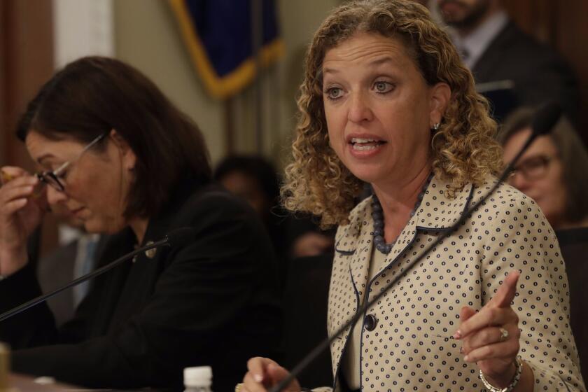 FILE - In this May 24, 2017, file photo, House Budget Committee member Rep. Debbie Wasserman Schultz, D-Fla. questions Budget Director Mick Mulvaney on Capitol Hill in Washington during the committee's hearing on President Donald Trump's fiscal 2018 federal budget. Fellow committee member Rep. Susan DelBene, D-Wash. is at left. Wasserman Schultz fired IT staffer Irman Awan on July 25, 2017, following his arrest on a federal bank fraud charge. (AP Photo/Jacquelyn Martin, File)