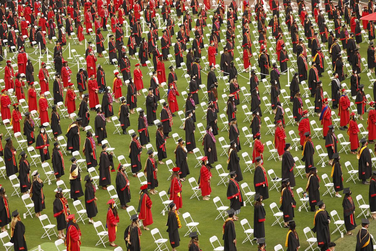 USC students participate in commencement exercises at the Los Angeles Memorial Coliseum.