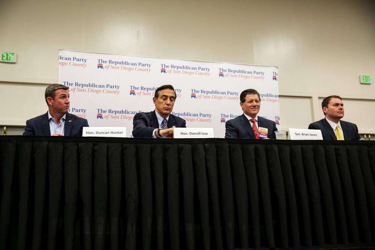 Republican candidates for the 50th Congressional District include Rep. Duncan Hunter, left, who has not withdrawn, along with former Rep. Darrell Issa, state Sen. Brian Jones and former San Diego Councilman Carl DeMaio. They took part in a candidate forum in October.