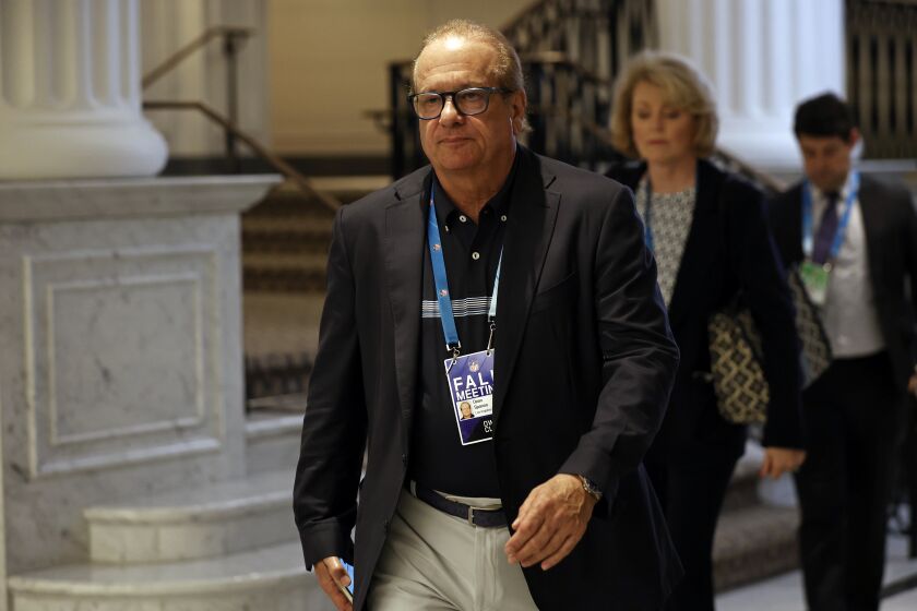 Dean Spanos, owner of the Los Angeles Chargers, leaves the NFL football owners meeting.