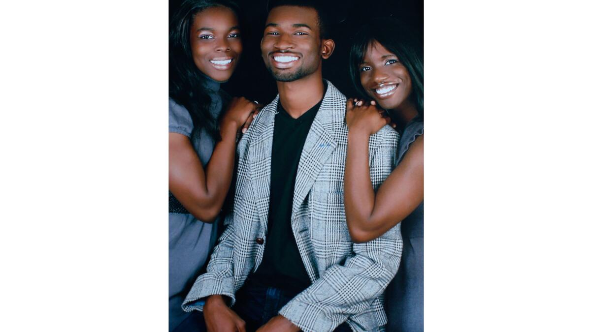 A photo of Reginald Murray and his sisters.