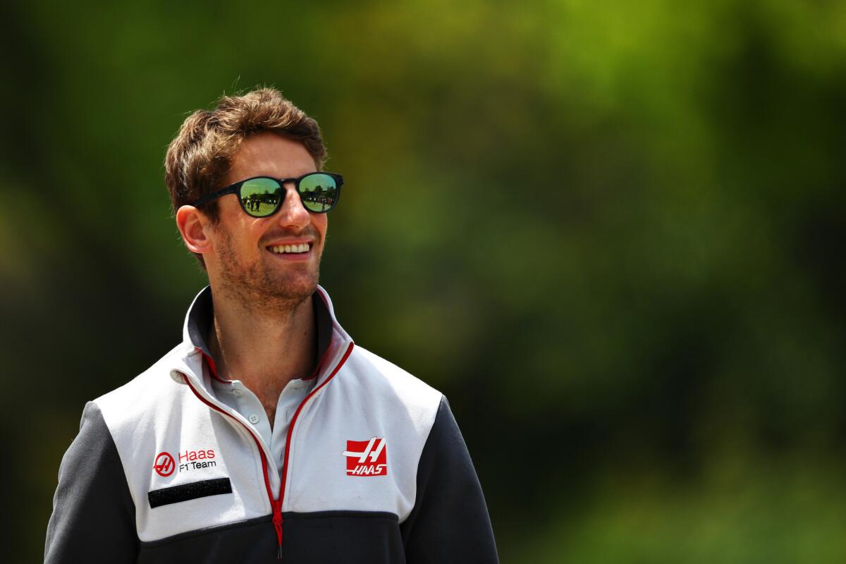 Romain Grosjean walks around the paddock before preparing for the Grand Prix of China at Shanghai International Circuit on April 17.
