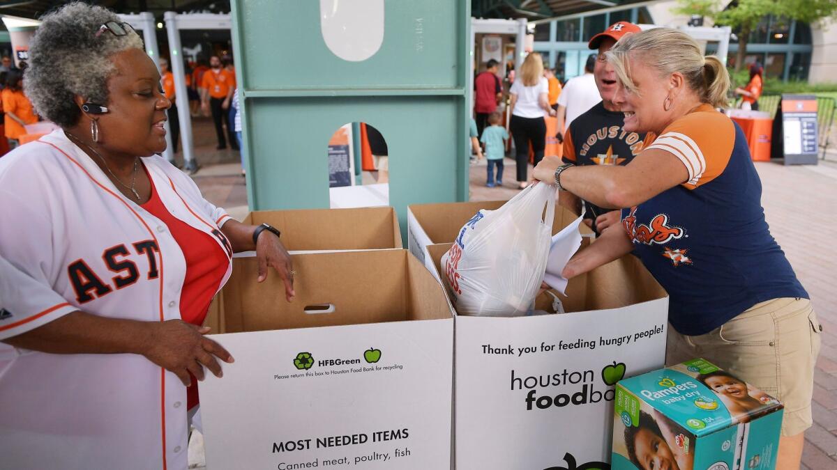 Donations for victims of Tropical Storm Harvey were collected at Minute Maid Park, where the Houston Astros played the New York Mets on Saturday.
