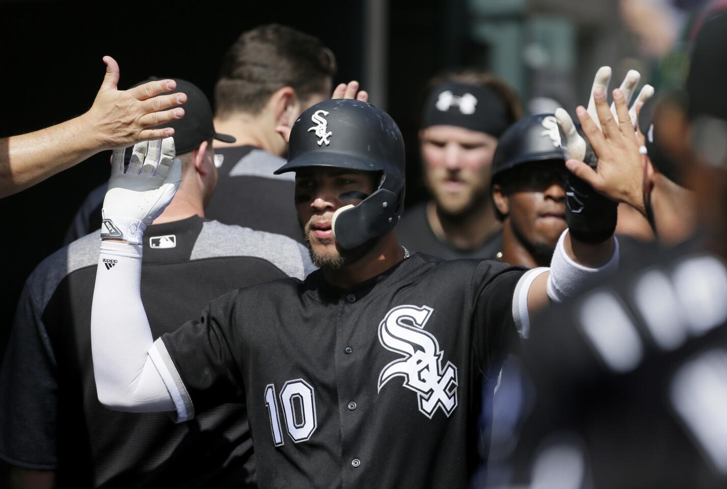 oan Moncada celebrates with teammates after scoring against the Tigers on a single by Avisail Garcia at Comerica Park in Detroit on Sept. 14, 2017.