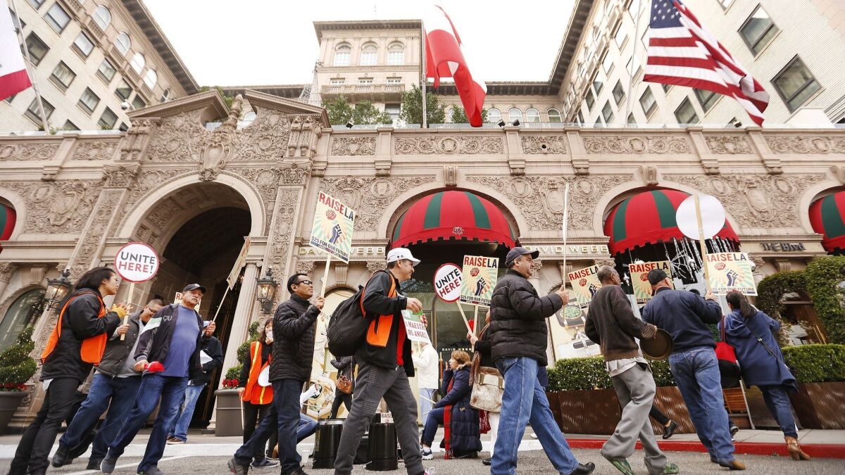 Hotel workers from Unite Here Local 11 demonstrate in front of the Beverly Wilshire, which does not yet have an agreement with the union to stave off a strike.