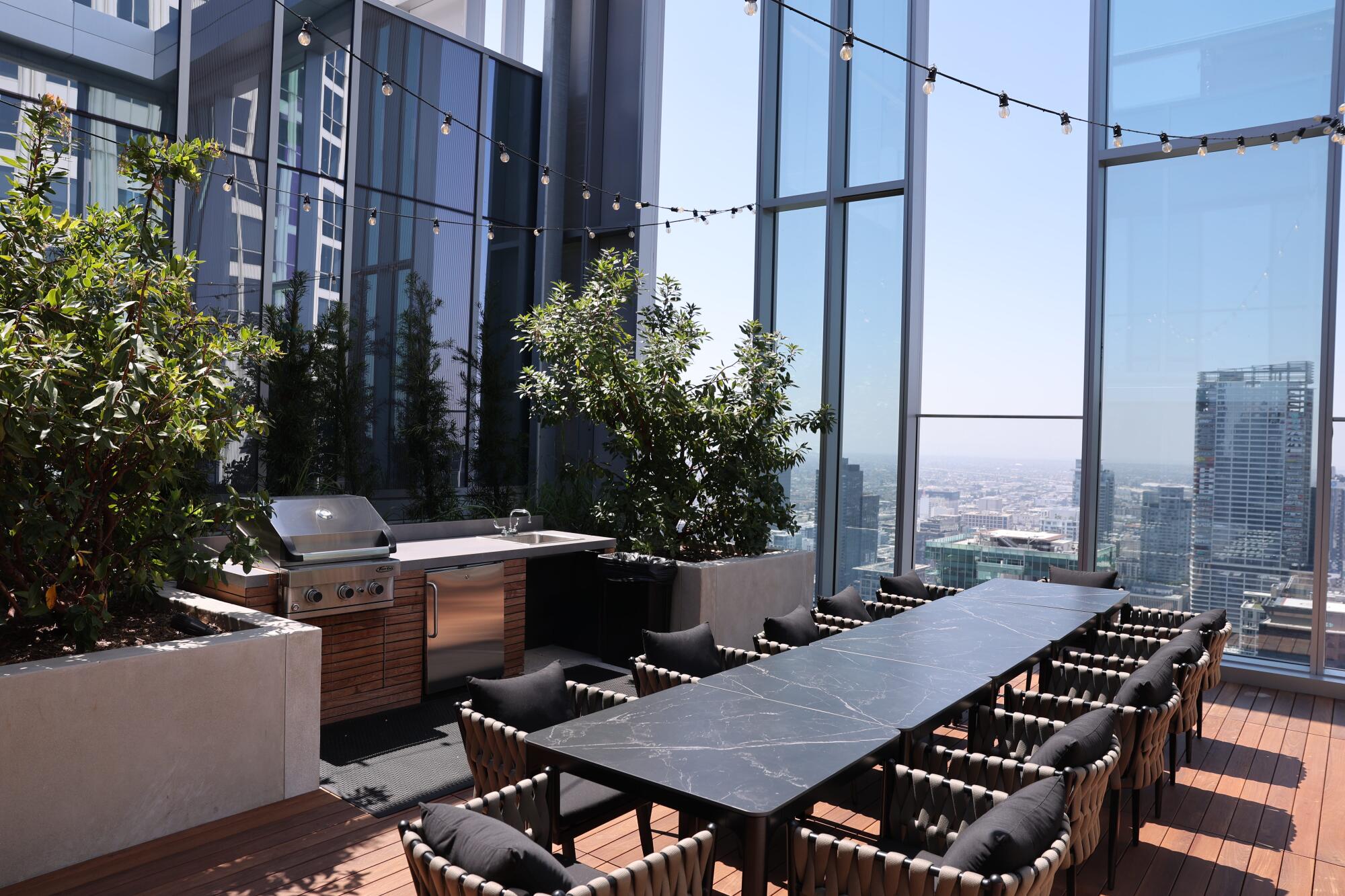 View of downtown buildings from a rooftop patio on the 41st floor of Figueroa Eight.