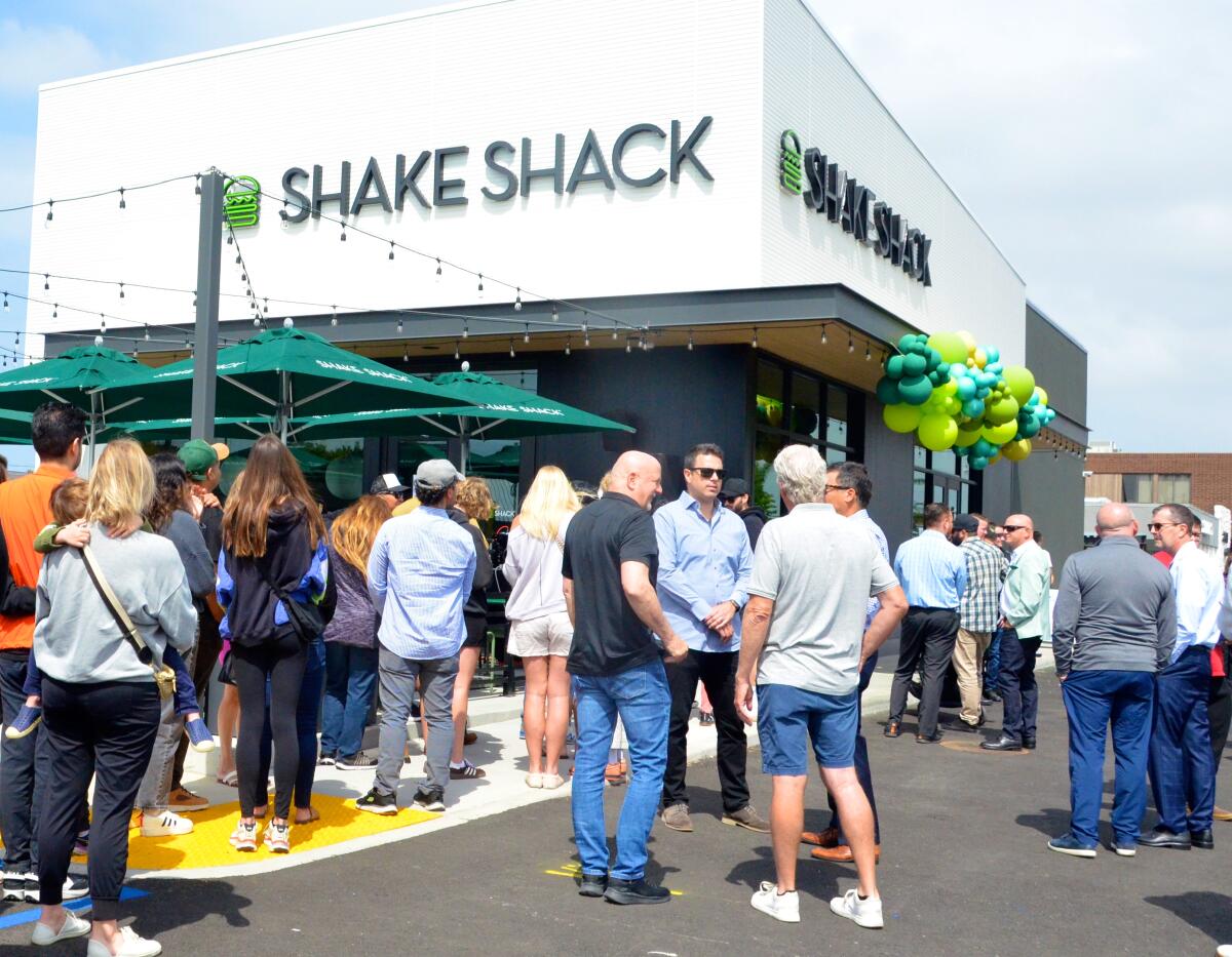 Shake Shack draws a line of hungry customers during its grand opening in Costa Mesa Thursday.